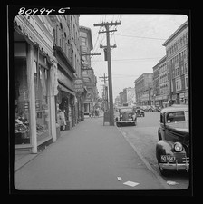 Photo:Downtown Main Street Bus Depot Drugstore 1930s Cars Pedestrians picture