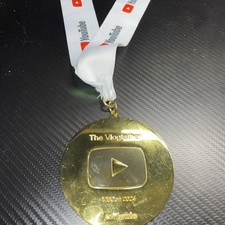YouTube Gold Metal Collectable Vidcon 2024 The vlogfather Vlog Father picture