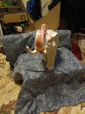 vintage white ceramic or porcelain elephant figurine whit painted pink ears and picture
