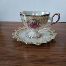 Royal Crown Porcelain Iridescent Teacup & Saucer with Courting Couple picture