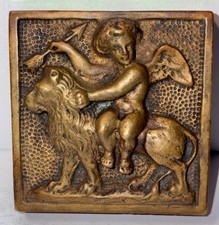 Antique Arts & Crafts Cast Bronze Cupid Riding Lion Paperweight Relief 2 1/8” picture