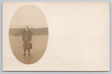 Postcard RPPC Woman Standing on a Frozen Lake picture