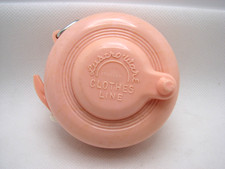 Vintage Lustro-Ware Pink Molded Plastic Indoor Retractable Clothesline 1940s-50s picture