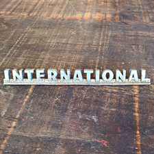 Vintage metal International Harvest hood or fender script emblem truck tractors picture