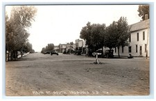 Postcard RPPC Main Street South Iroquois South Dakota Dirt Road c1910s Old Cars picture