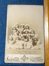 Antique Cabinet Card Photo 12 young girls holding 12 dolls Grand Rapids 1892 picture