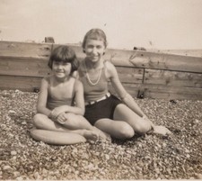 1930s Two Girls Seated On Pebble Beach Seaside Childhood Group Portrait picture