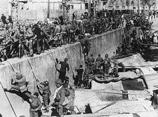 Japanese troops clamber up the Suzhou Creek on arriving in the Hon- Old Photo picture