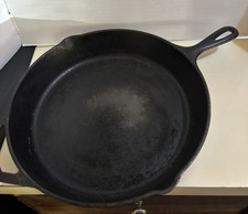 This item is a Lodge Cast Iron Skillet, specifically identified as a Vintage 12” picture