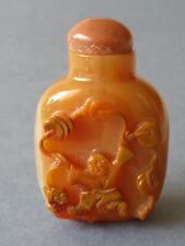 OLD CHINESE CARVED BUTTERSCOTCH AGATE SNUFF BOTTLE - BOY WITH A STRING OF COINS picture