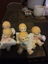 vintage style porcelain baby figurines wearing pastel blue and pink bibs  picture