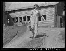 Photo:Farm Worker Carrying Bucket Barn Rural 1930s-1940s Male Laborer picture