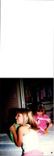 Two little girls on bed being silly playing with toys Found Photo V1591 picture
