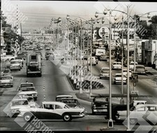 1963 A busy street with many cars and street lights picture