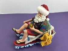 Clothique Possible Dreams Santa On A Beach Chair Holding A Cocktail  picture