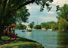 Toronto Island showing train, boats and Toronto Skyline postcard picture