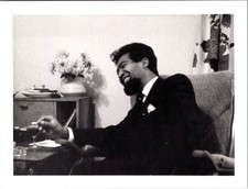 Vtg B&W Snapshot Smiling Man Beard Suit Holding Drink Armchair Interior 1960s picture