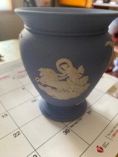 Small Wedgewood blue vase/cup with ink stain on the back picture