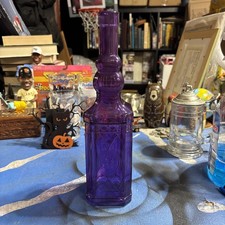 vintage-style square purple glass decorative bottle or bud vase picture