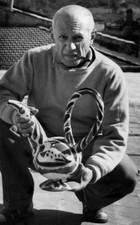 An undated photo shows Spanish artist Pablo Picasso posing a poter- Old Photo picture
