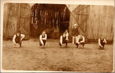 Men Playing Game Bricks Barn Building Rural Americana Postcard Real Photo RPPC picture