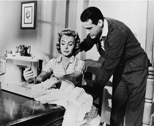 American actress Donna Reed sews sewing machine as American actor - Old Photo picture