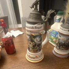 German Lidded Stein with Military Scene, Figurine Lid, and German Text picture