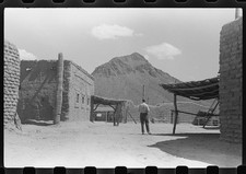 Photo:1930s Desert Adobe Village Mountain Scene Man Standing picture