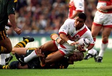 England's Jason Robinson is brought down by Australia's Geoff Toov- Old Photo picture