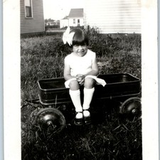 c1940s Cute Young Girl 4.5 Years Old Sitting Toy Wagon Snapshot Photo Velvet Bow picture