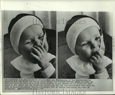 1964 Press Photo Mary Ann, one of the Fischer quintuplets chews on cap tassel picture