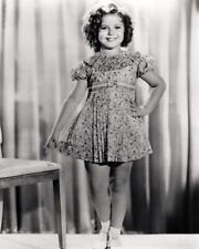 Shirley Temple hand on hip smiling standing by chair 24x36 inch poster picture