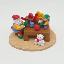 Vintage 1992 Avon Christmas With Santa Ornament in the Workshop picture