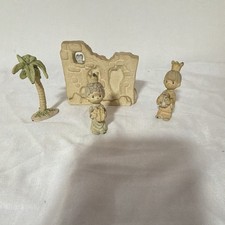 pieces from a vintage 1989 Precious Moments miniature nativity set picture