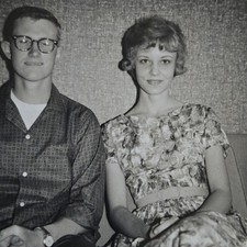 Vintage B&W Photo Snapshot of Smiling Young Couple Sitting on Couch picture