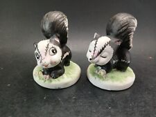 Ceramic Skunk Figurines Vintage Small Chips On Flowers  picture