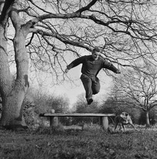 British cricketer umpire Peter Loader wearing a tracksuit as jumps- Old Photo picture