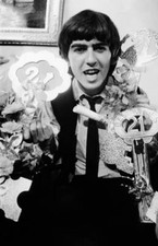 Beatles guitarist George Harrison posing some gifts that fans s- 1964 Old Photo picture