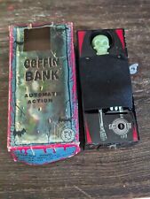 VINTAGE 1960'S TIN LITHOGRAPH WIND UP COFFIN BANK YONE FROM JAPAN picture