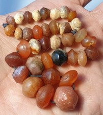 A STRAND OF 36 ANCIENT WESTERN ASIAN CARNELIAN BICONE AGATE BEADS (8mm to 16mm) picture