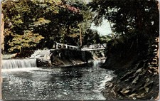 Antique Postcard with Waterfall and Bridge in Forest Setting picture
