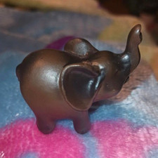 Small Dark Brown Metal Elephant Figurine Sculpture with Raised Trunk picture