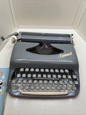 Vintage Consul portable typewriter from the 1960s manual and its case picture