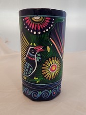 This vintage Mexican mug is a unique piece of pottery with a hand-painted design picture