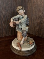 Vtg Giuseppe Armani Boy Put On Sock Figurine  picture