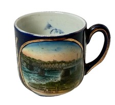 CALAIS MAINE ME Antique INTERNATIONAL BRIDGE Souvenir TRINKET COBALT TEA CUP picture