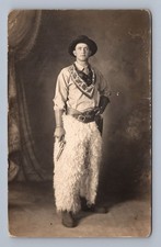 Cowboy w Revolver & Wooly Chaps Haddan RPPC Coffeyville KS Studio Photo ~1910s picture