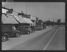 Photo:Nyssa Oregon Main Street 1939 Dorothea Lange FSA storefronts cars picture