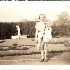 c1930s Cute Lady Formal Garden Snapshot Photo Statues Hedges Floral Flower Beds picture