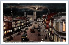 K38/ Geneva New York Postcard c1915 Seneca Street Stores Night 434 picture